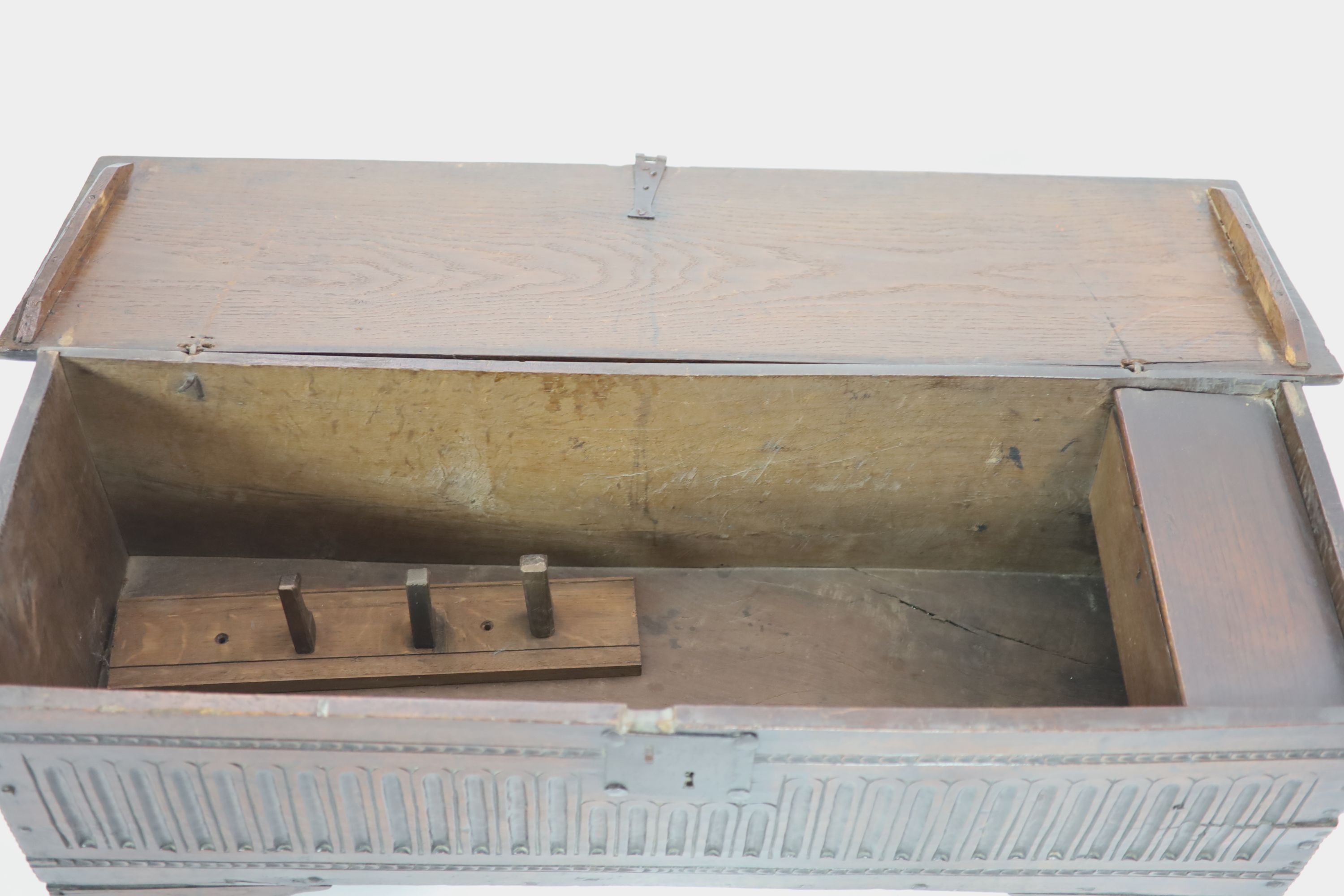 A 17th century oak six-plank chest H 64cm. W 124cm. D 38cm.